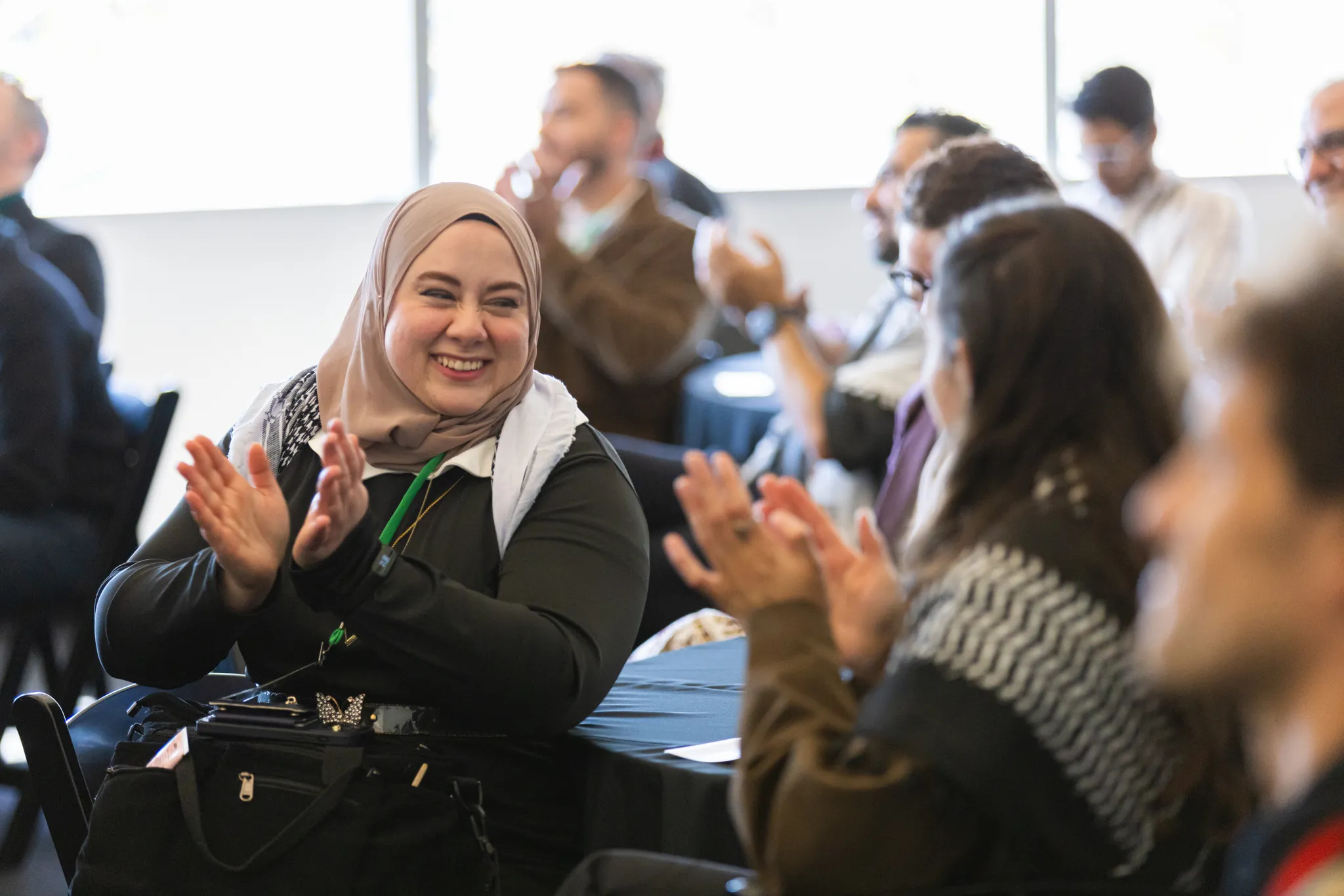 Tech for Palestine community members applauding at an event