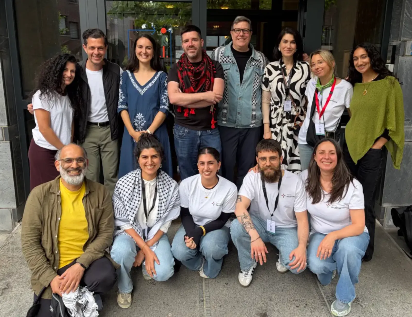Tech for Palestine members gathered outside a venue at a community event